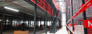 Mezzanine Flooring With black Stairs and red mesh