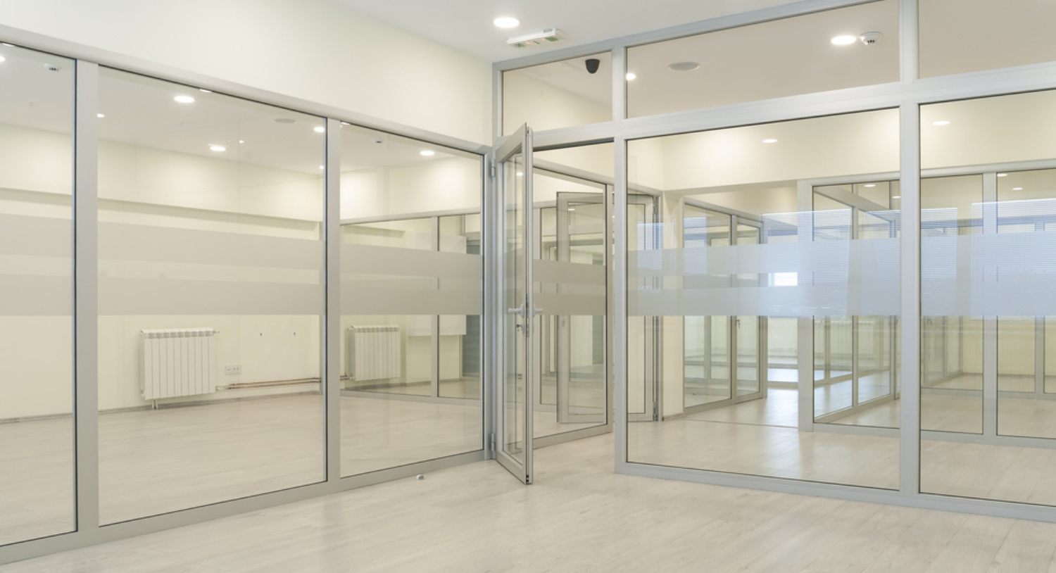 Office partitioning involving the installation of glass walls