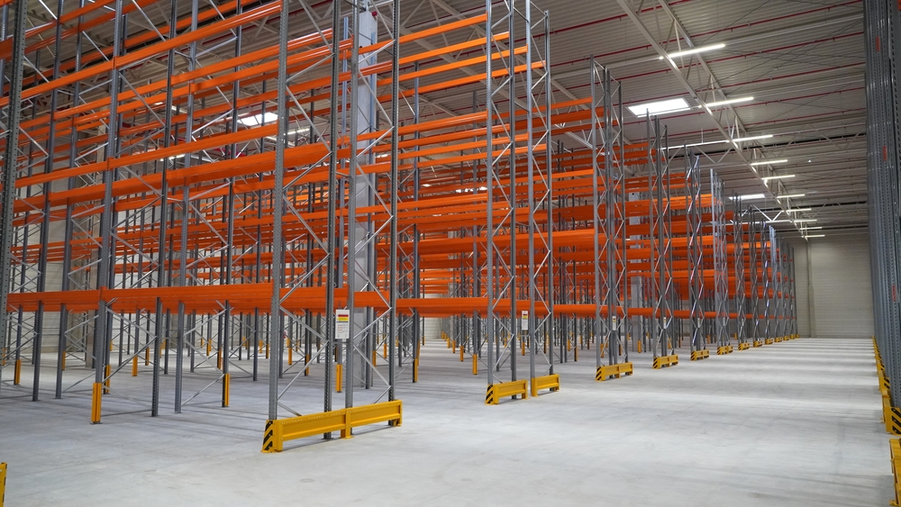 Empty warehouse with shelving storage solutions